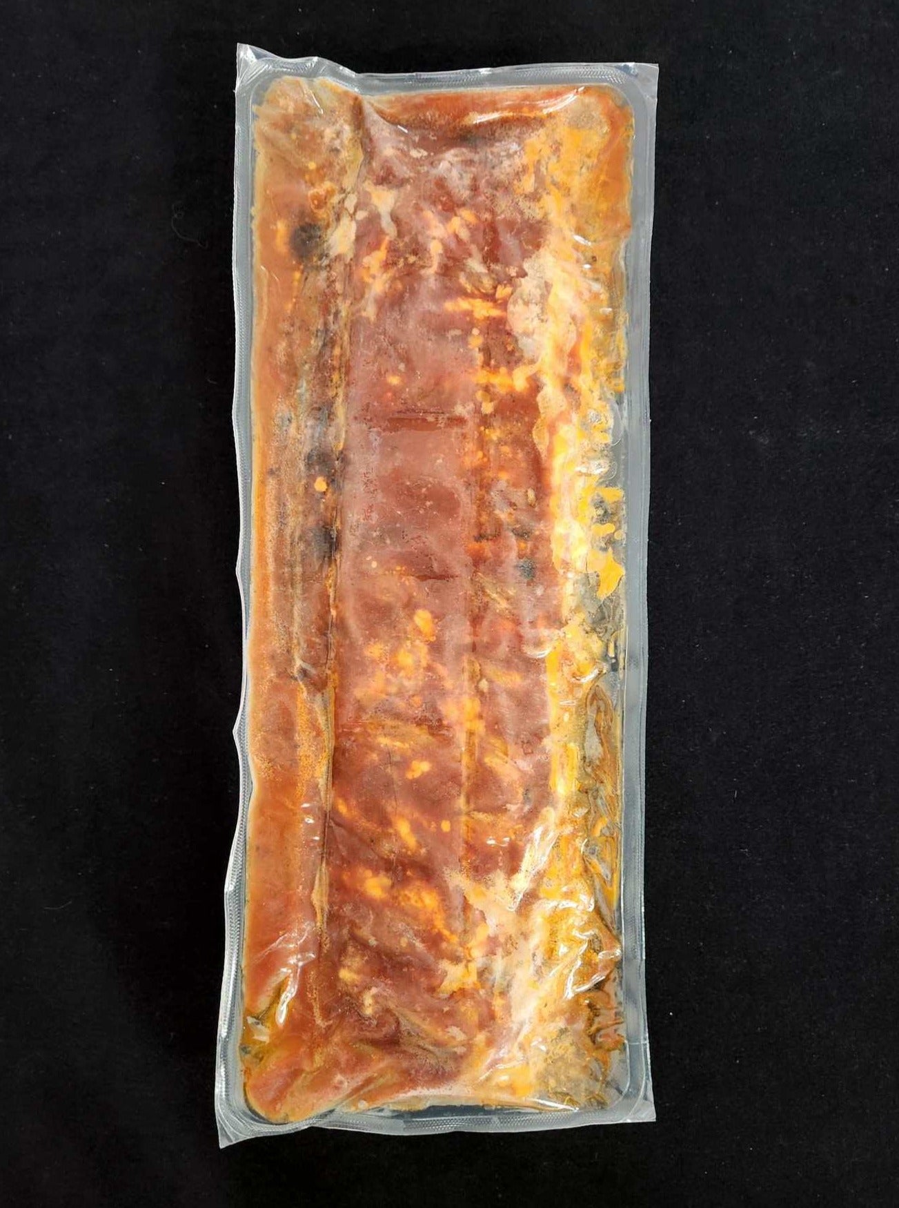 Côtes de dos de porc fumée et cuites en sauce BBQ / Smoked and Cooked Pork Back Ribs in BBQ Sauce - 500g
